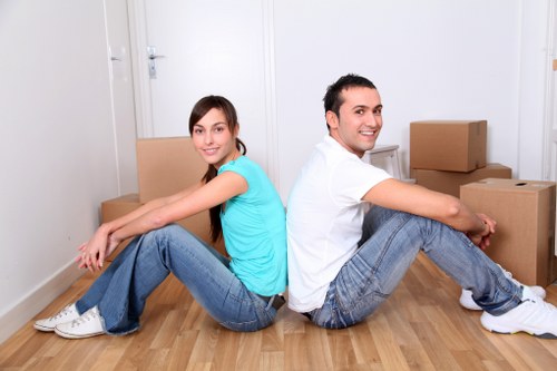 Professional movers handling furniture during a local house move