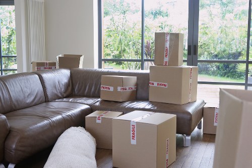Packed office boxes and labeled equipment ready for transport